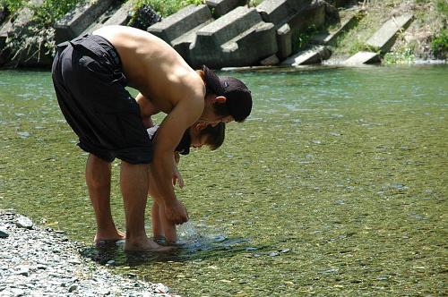 playing in a calm part of the Akui-gawa River