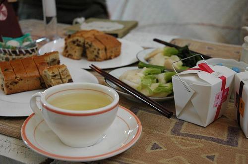 Drinking soba-cha and eating the treats that people brought.